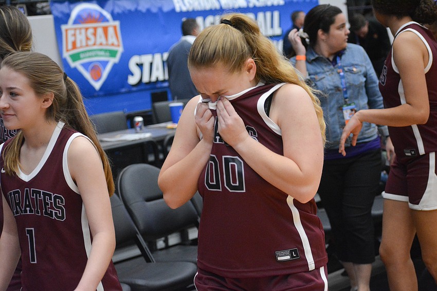 Chelsea Morin wipes away tears as she leaves the court for the last time this season.