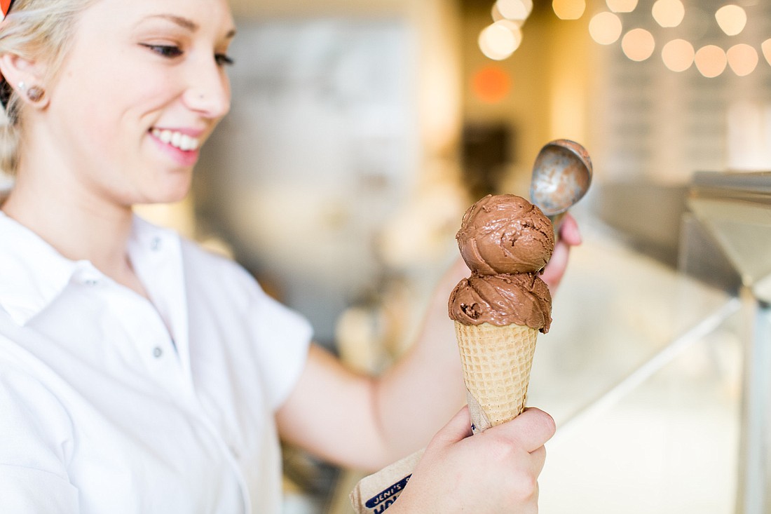 A Jeni&#39;s employee adds a scoop of dairy-free chocolate ice cream to a cone. Jeni&#39;s expects to open a location in Sarasota this summer. Courtesy photo.