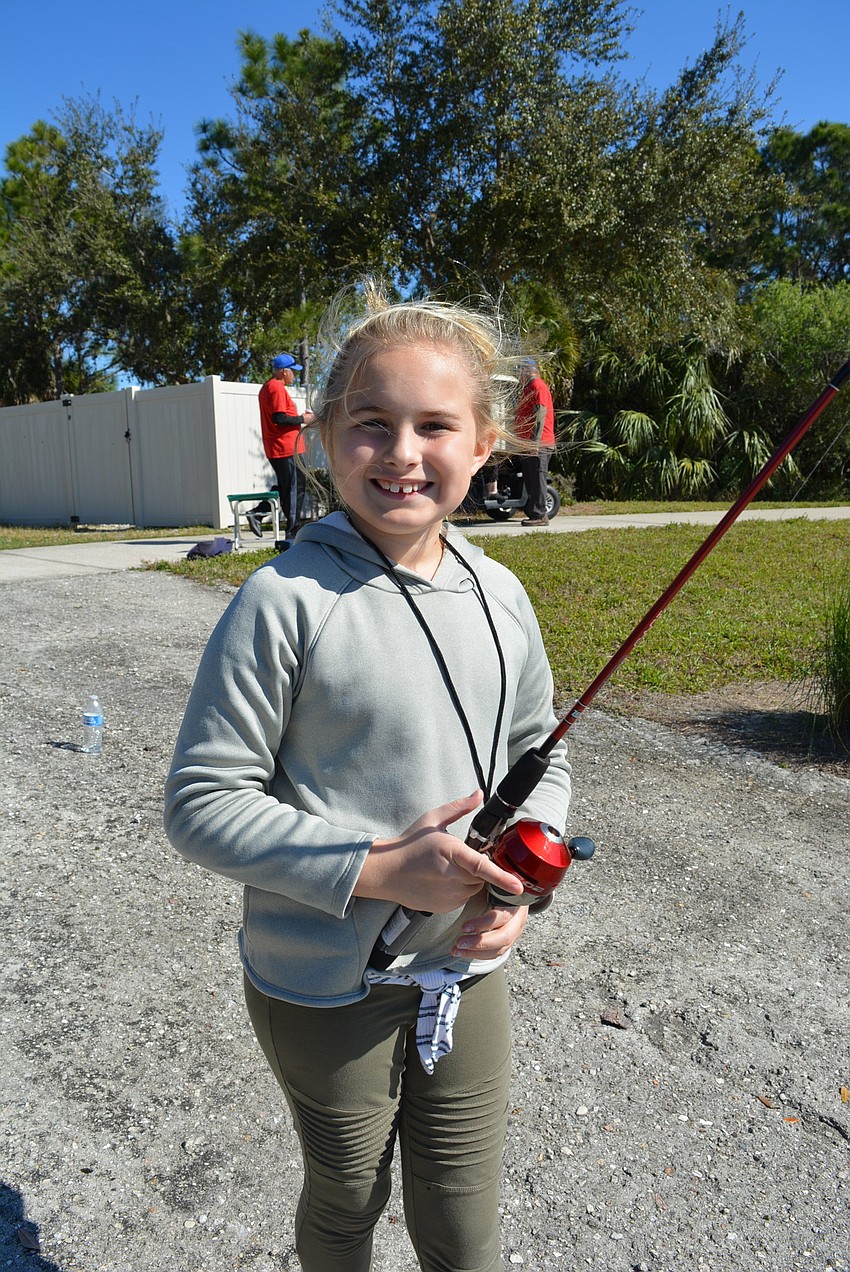 McNeal Elementary School third grader Cora Kovatch normally fishes at the beach, but says she likes lake fishing because 