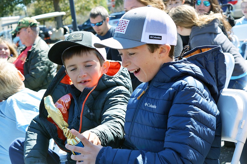 Six-year-old Edward Lucrey of Lakewood Ranch was happy for his brother, 8-year-old Raphael Lucrey, who could not stop smiling after winning his first-place trophy.