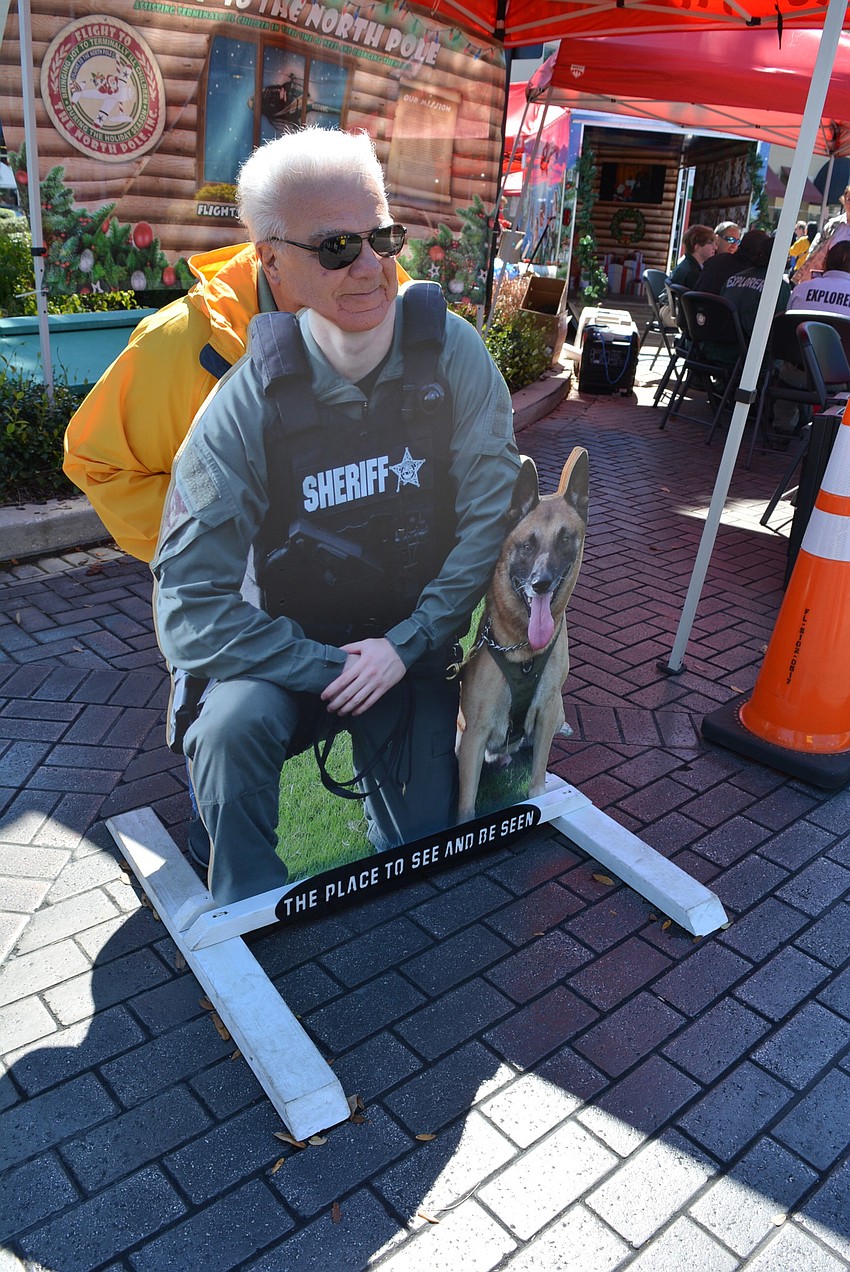 Vincent Castagno poses for a photo for his wife, Irene. They were visiting from Connecticut.