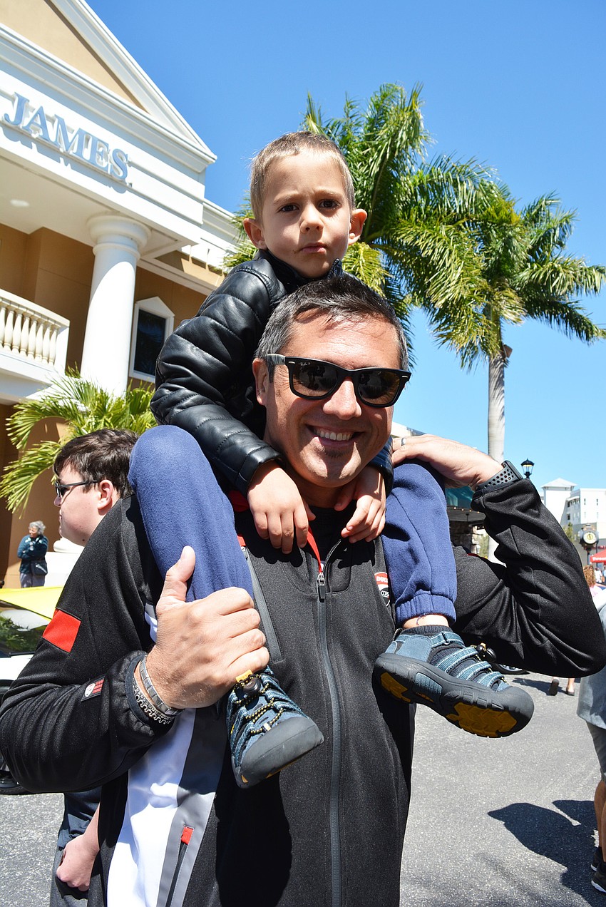 Fabrizio Uberti Bona and his father, also Fabrizio Uberti Bona, pacified their love of cars by seeing all of them at the show. They particularly liked an orange Lamborghini.
