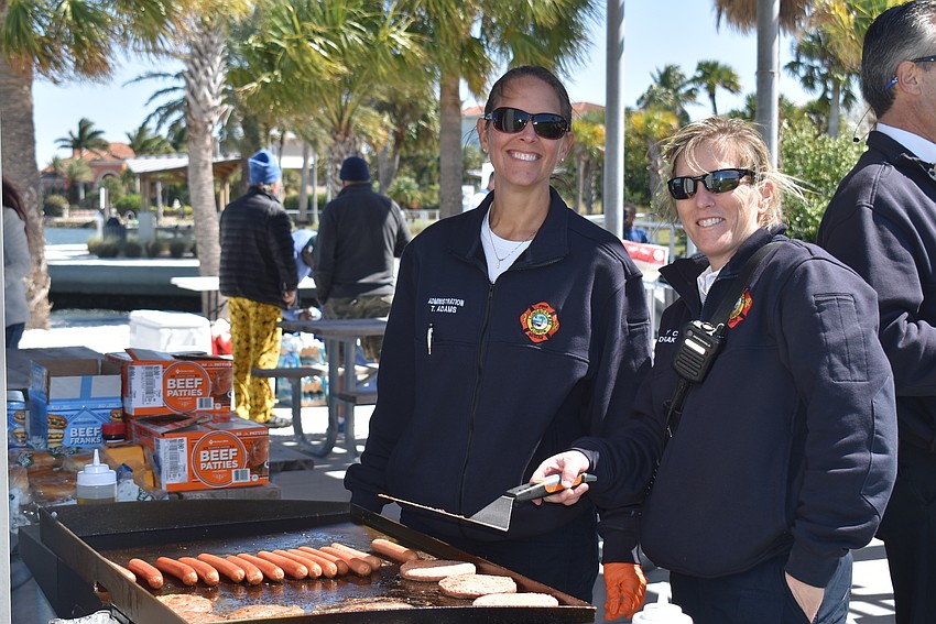 Tina Adams and Sandy Drake run the grill.