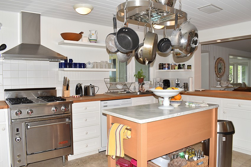 A spacious, well-lit kitchen occupies the back of the home.