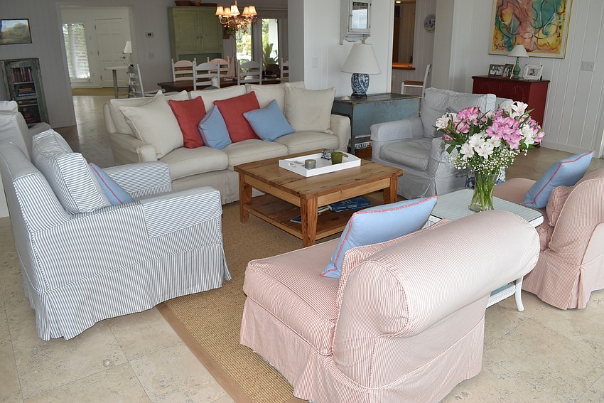 Seating with muted tones fill the living room.