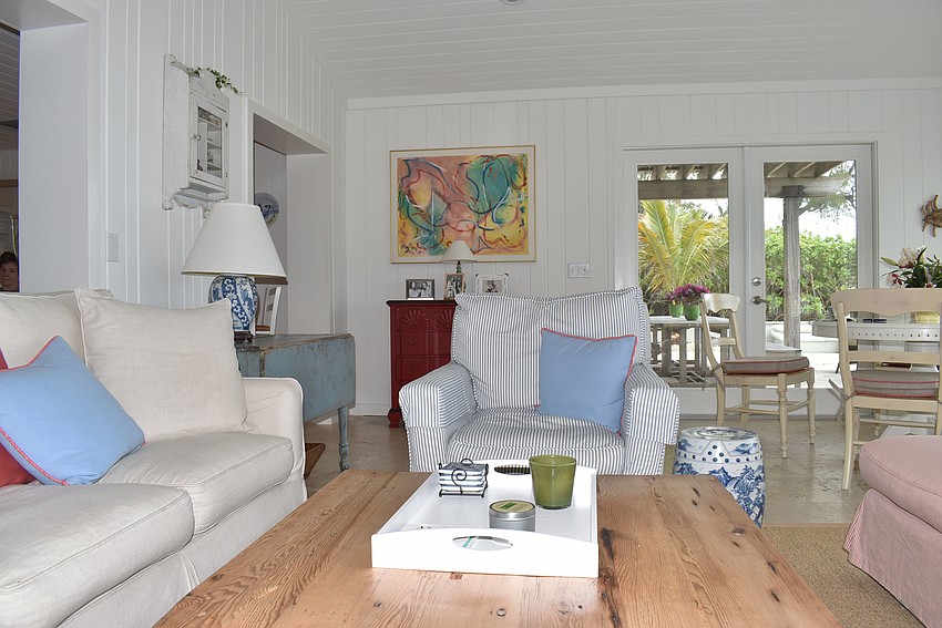 Blue accents dot white furniture.