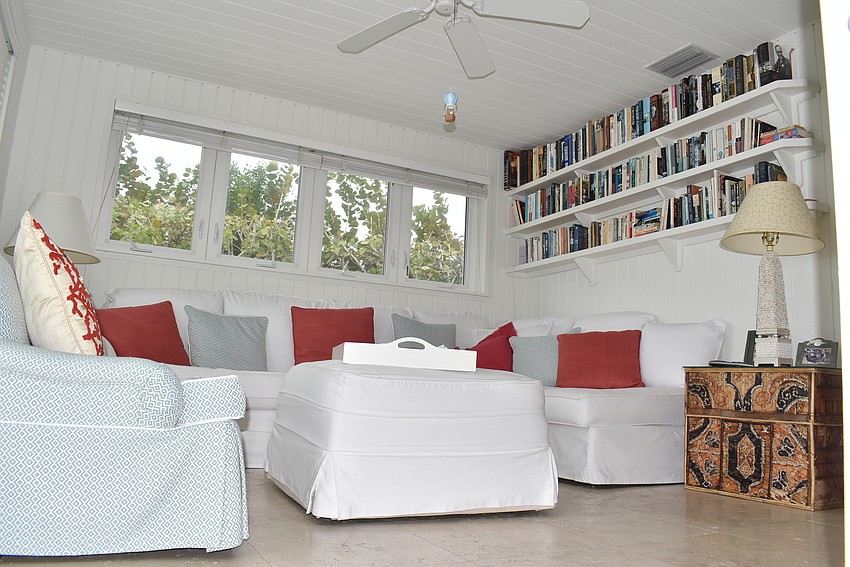 In this room, Horne has books and even more seating to enjoy the light coming in from the many windows.