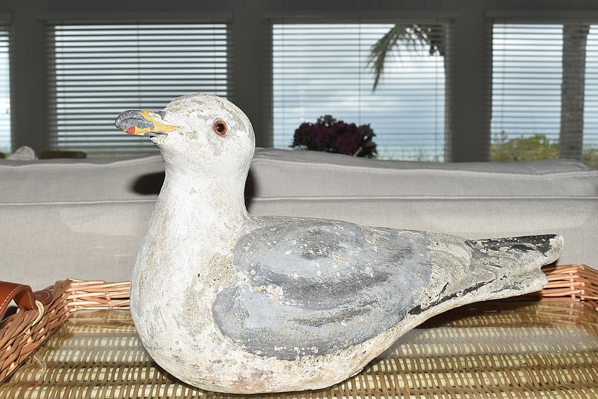 An old stone seagull guards the entrance to the living room.