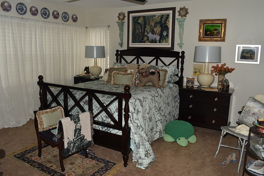 Another guest bedroom is accented with a turtle footstool.