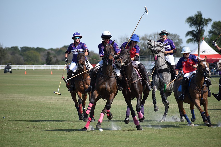 Alyson Poor of Avalon Farms and Izzy Parsons of Ten Oaks bump horses as the compete to get to the ball.