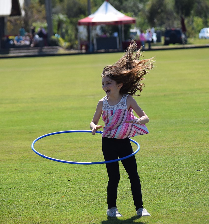 Lakewood Ranch's Sara Downs shows her Hula Hoop skills before the game.
