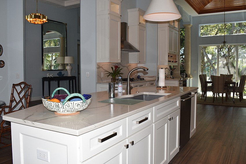 The kitchen flows into the seating area.