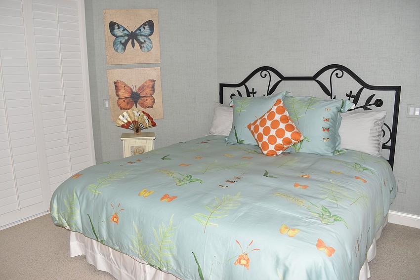 A guest room is accented with orange.