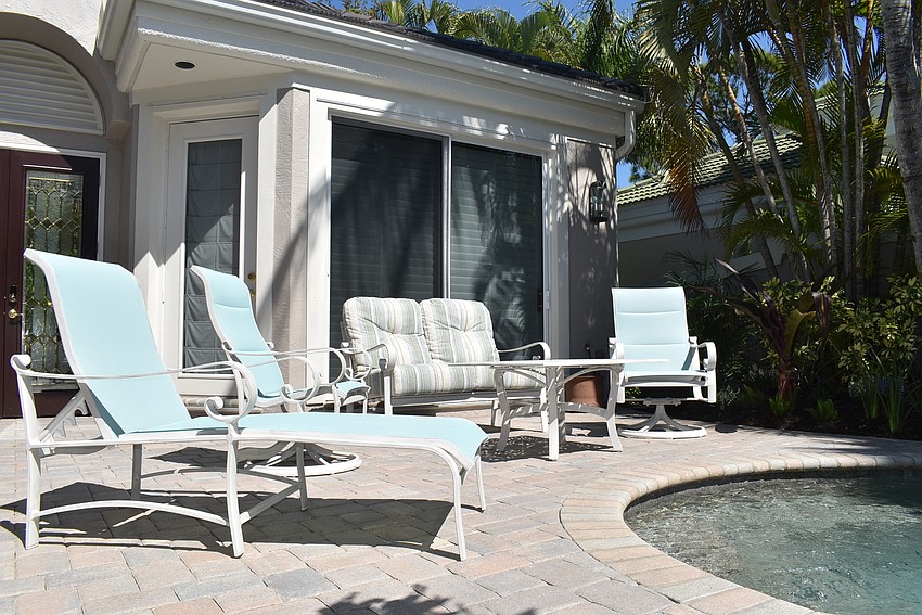 Plenty of seating surrounds the pool.
