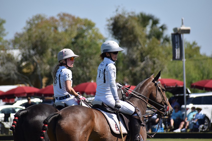 San Saba teammates Taylor Scilufo and Dawn Jones rest for a moment between chukkers.