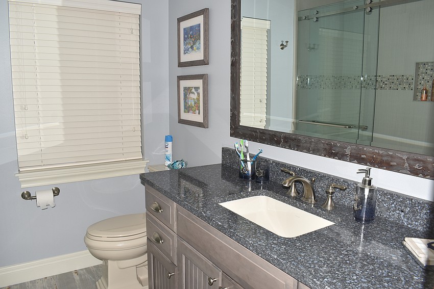 The Yahns make use of blue and gray in their bathroom.