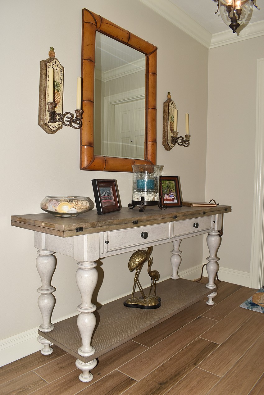 The Yahns welcome guests into their home at this console table near the entrance.