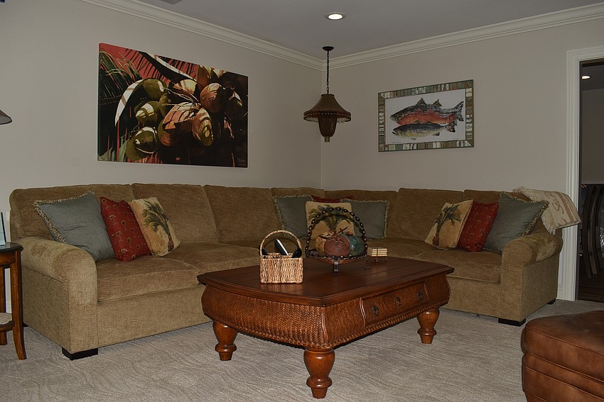 The living room is done in darker tones for cozier nights.