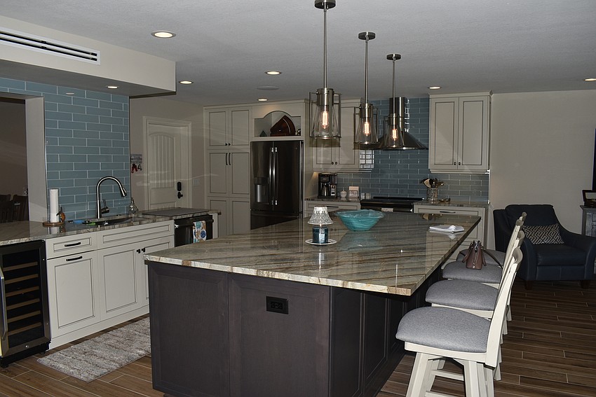 The spacious kitchen centers the home.