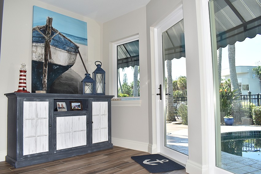 The Yahns recently acquired this painting, which leans against the wall and hides the light switches.