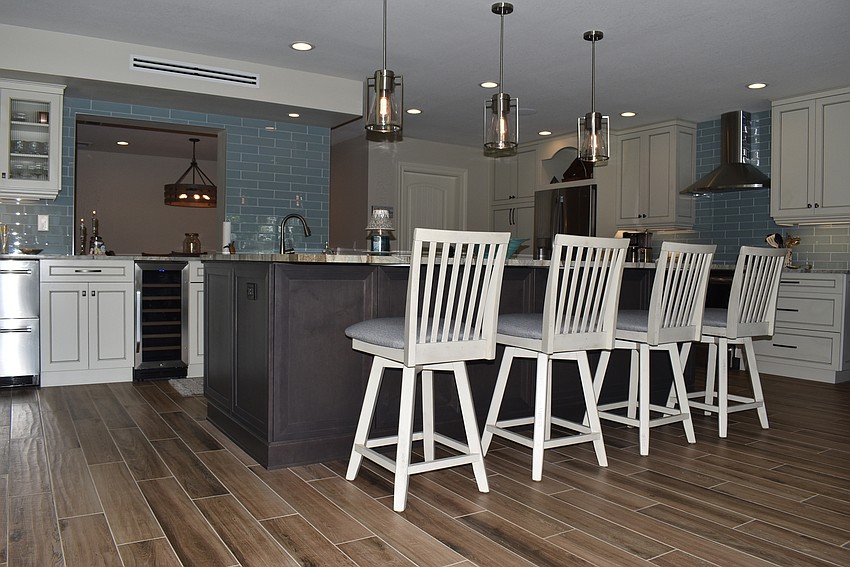 The Yahns offset the dark gray with white chairs and silver accents.