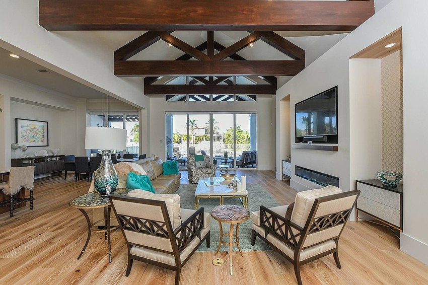 The spacious living area features wood beams that head outside of the house as well. Photo courtesy of Angela Nutter.