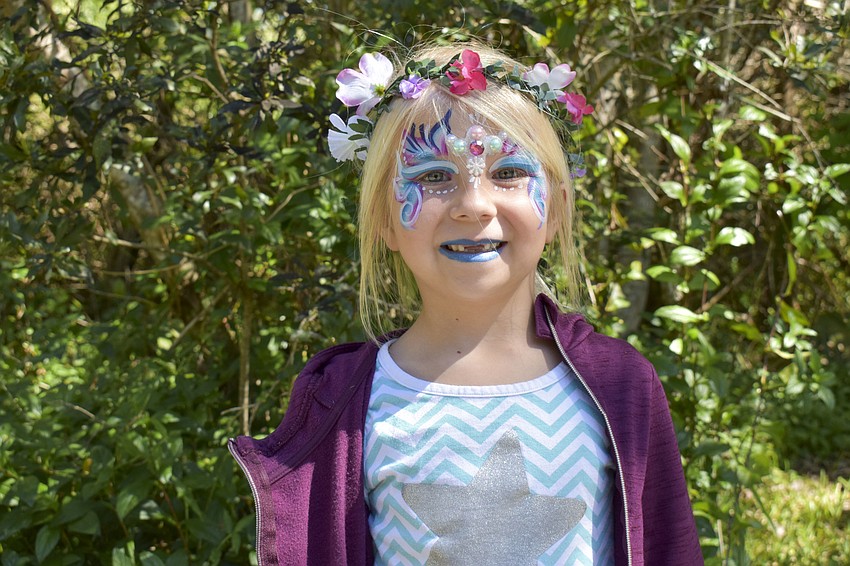 Abigail Hartley, 6, made sure her face paint matched her outfit.