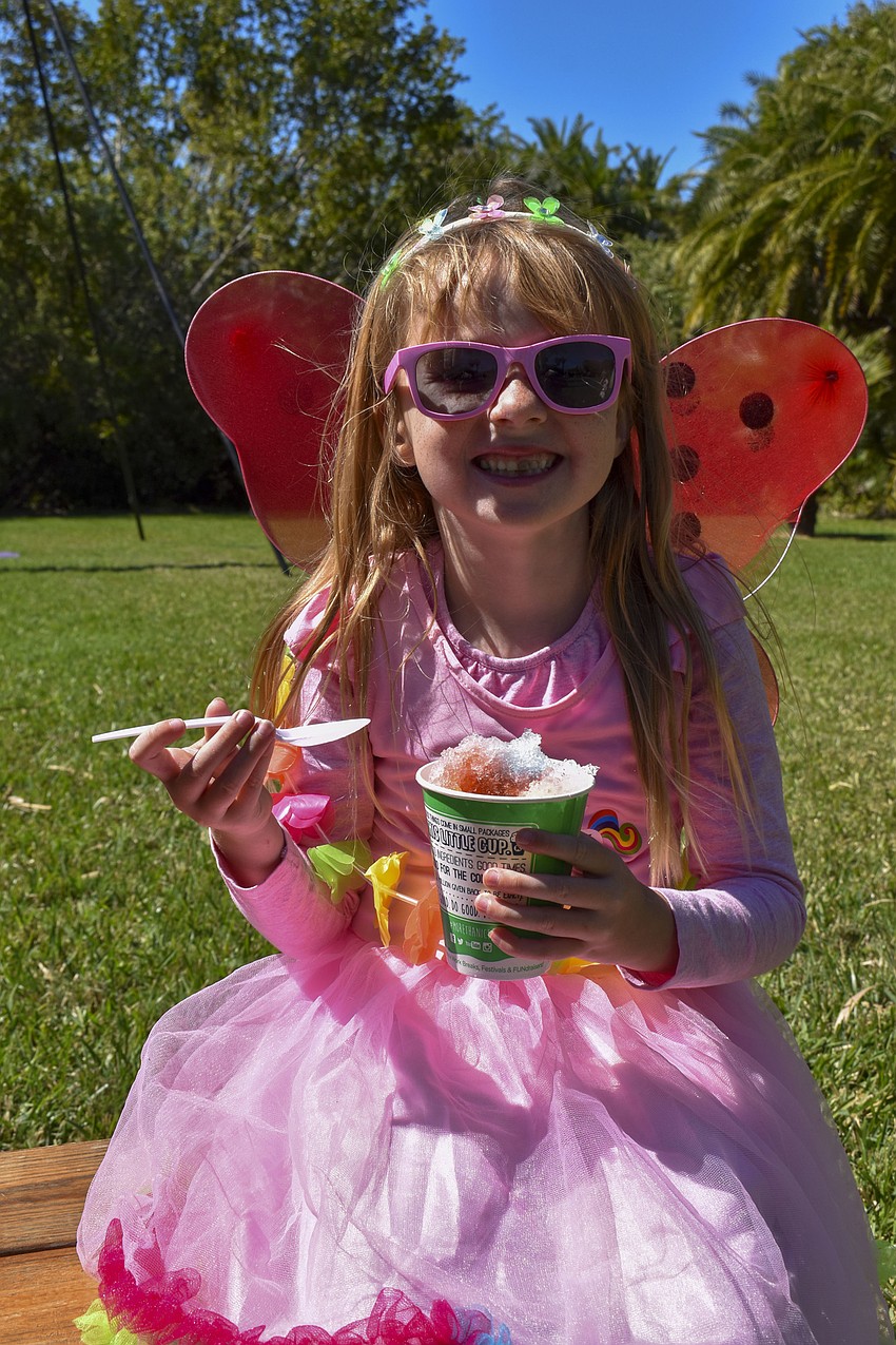 Andie McDonald, 5, eats her shaved ice.
