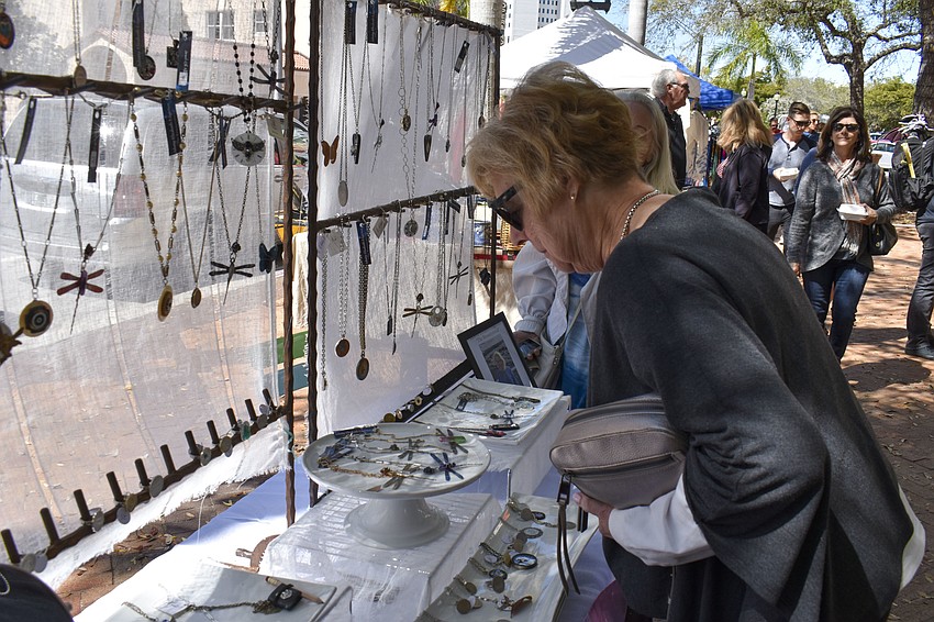 Linda Vance looks through The Resources jewelry.