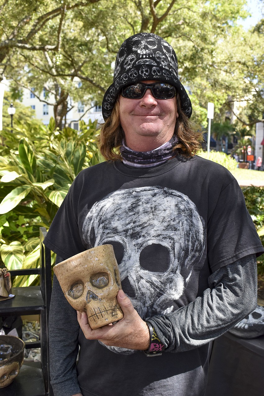 Skullee the Sculptor with one of his skull pots.