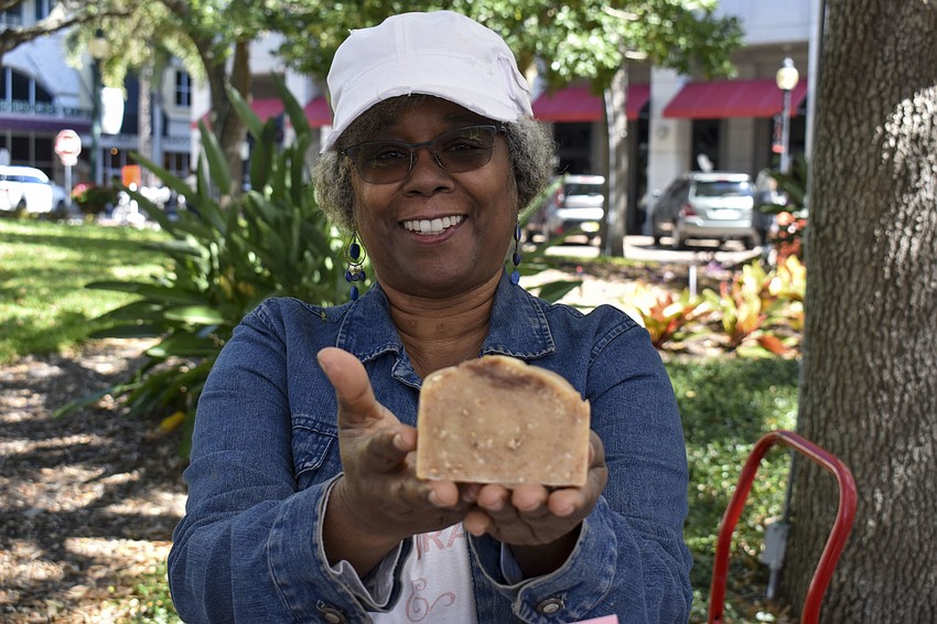 Sylvia Colbert holds up one of her oatmeal soaps.