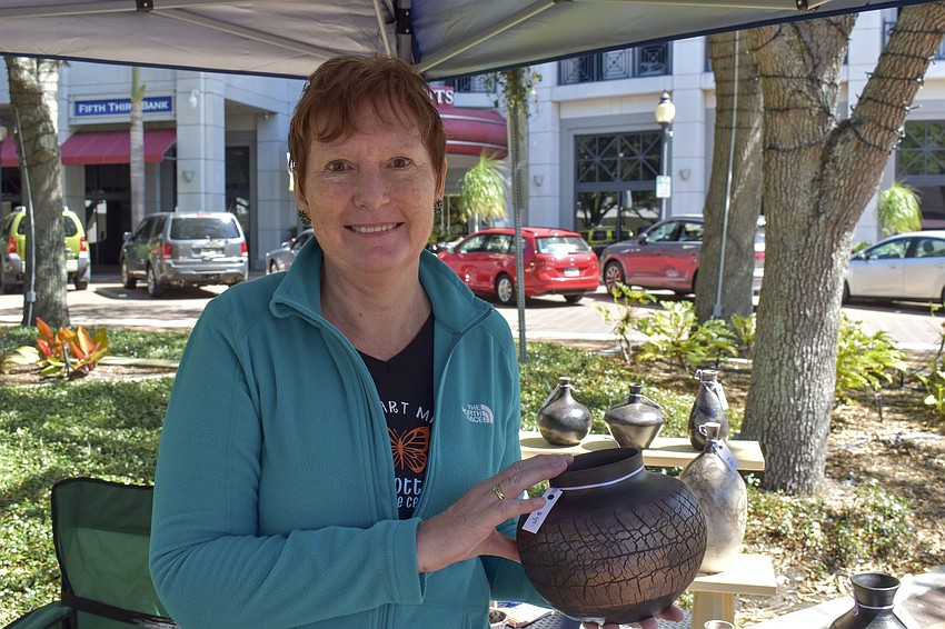 Wilma Kroese shows off one of her favorite pots.