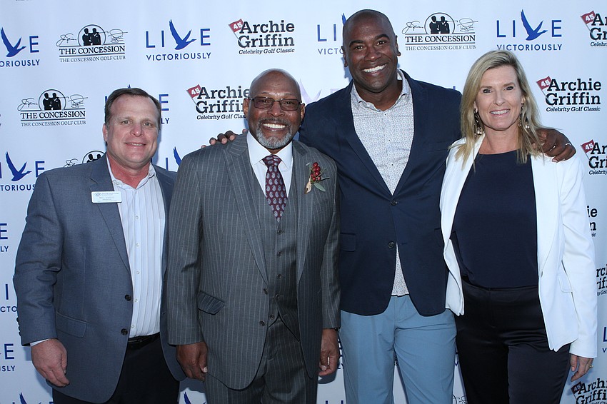 Boys & Girls Clubs of Sarasota County president Bill Sadlo, Archie Griffin, and Visible Men Academy co-founders Neil Phillips and Shannon Rohrer-Phillips