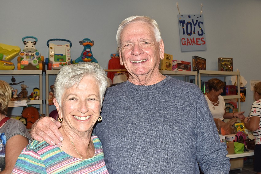Kathy and Bob Neudorfer, reunited after losing each other during the sale.