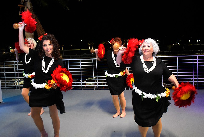 Vickie Inglese and Susan Pomerantz perform a hula dance.