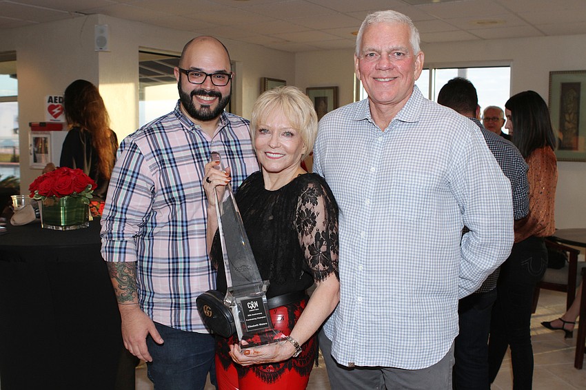 Roger Capote, 2019 Fundraising Champion Elisabeth Waters and CAN Community Health president and CEO Richard Carlisle