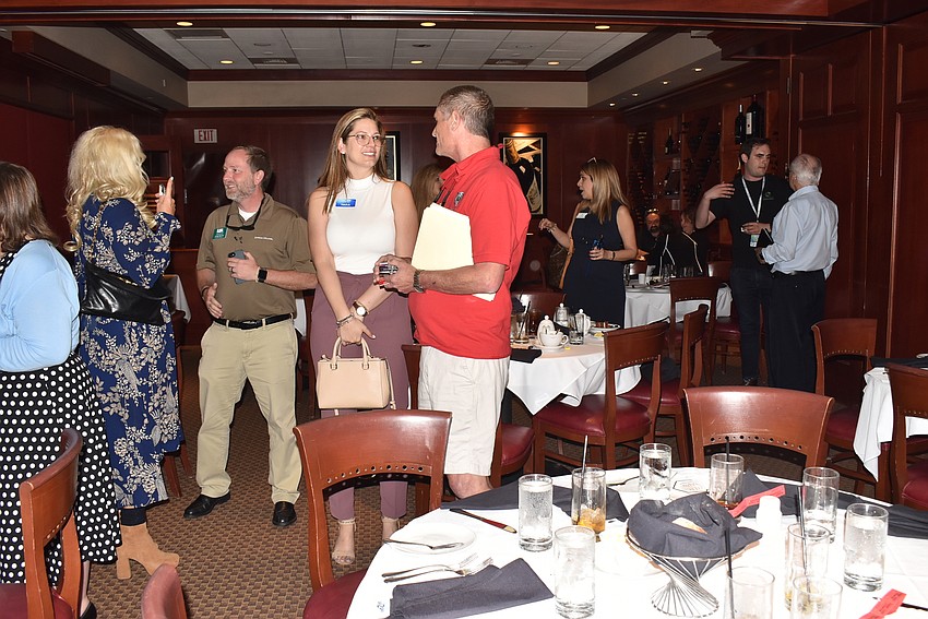 After lunch, attendees stayed and talked.