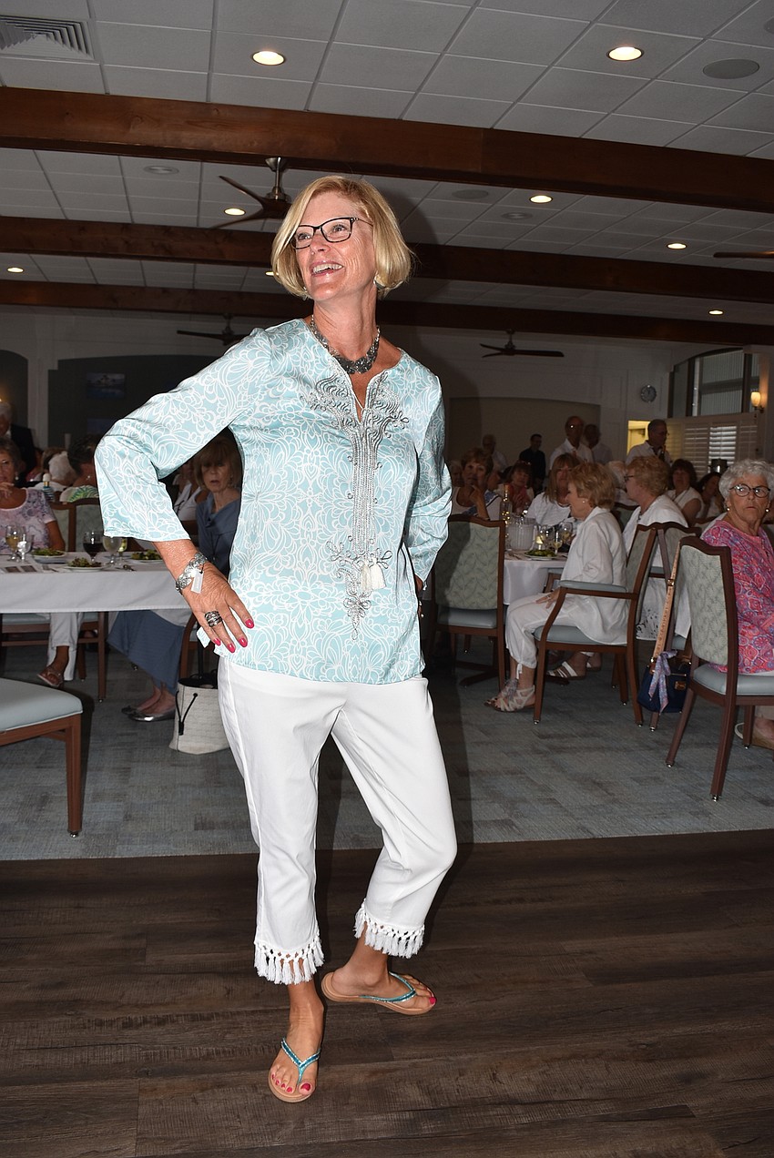 Brenda Nelson walks the room.