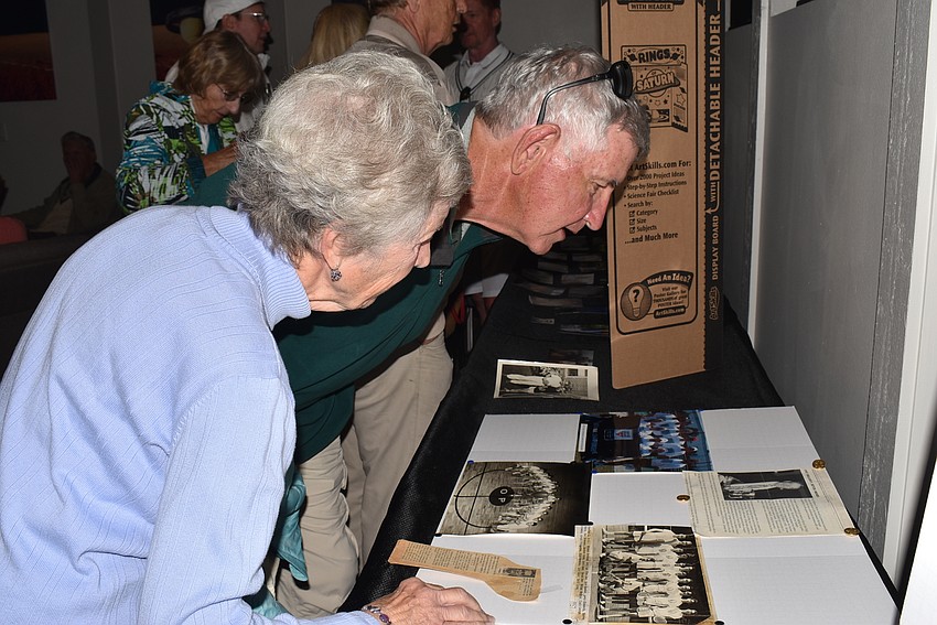 Louise and Art Williams look at photos.