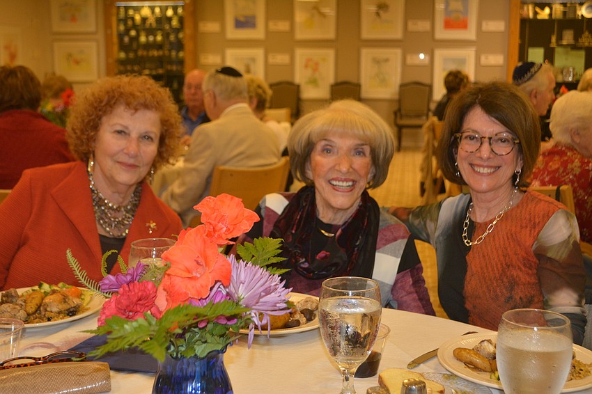 (Left to right) Gloria Feibus, Doris Kaplan and Elaine Kaufman pose during shabbat dinner Friday night at the inaugural Israel Weekend at Temple Beth Israel.