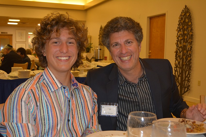 Lee Mirman (right) and his son, Gabriel Mirman, pose during shabbat dinner Friday night at the inaugural Israel Weekend at Temple Beth Israel.