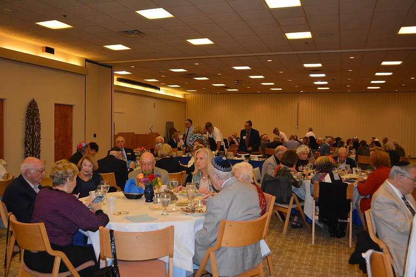 Attendees of the inaugural Israel Weekend eat during shabbat dinner Friday night at Temple Beth Israel.