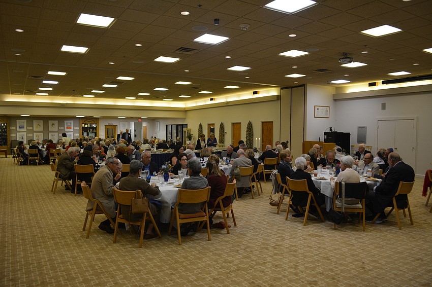 Attendees of the inaugural Israel Weekend eat during shabbat dinner Friday night at Temple Beth Israel.
