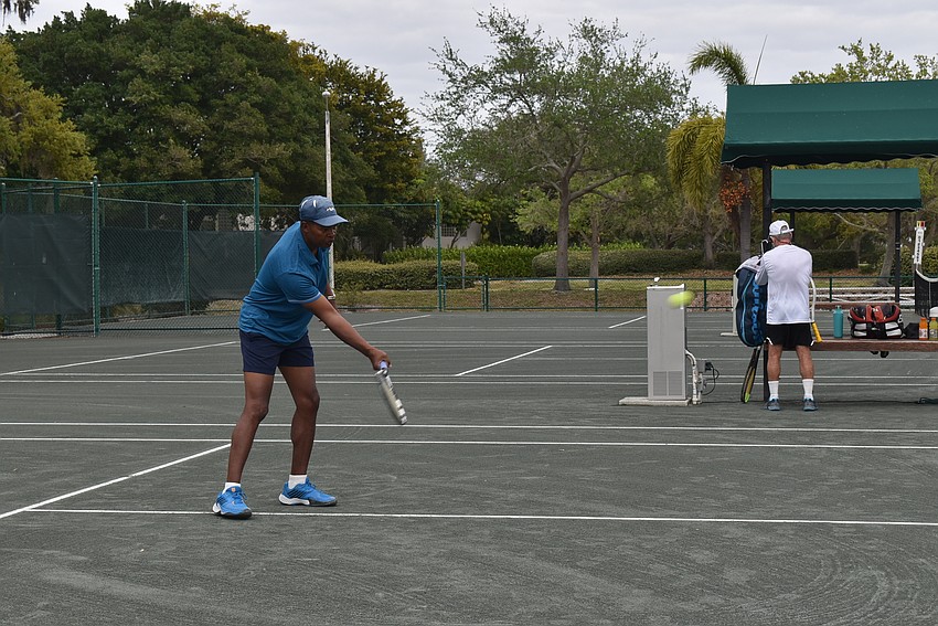 Ron Shields warms up on the court.