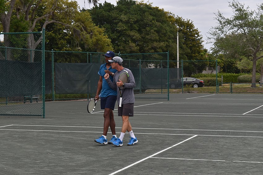 Ron Shields and Claudio Rettean discuss before play kicks off.