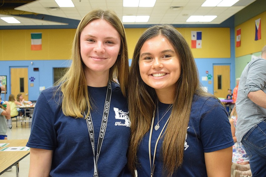 Ariana Aikman, a senior at Lakewood Ranch High School, and Valeria Pankey, a junior, volunteer to help students during different science activities. 