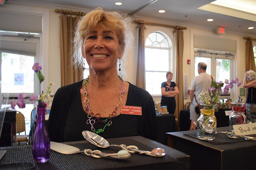 Barby Comins, a self-taught artist, shows off her barbed wire designs.