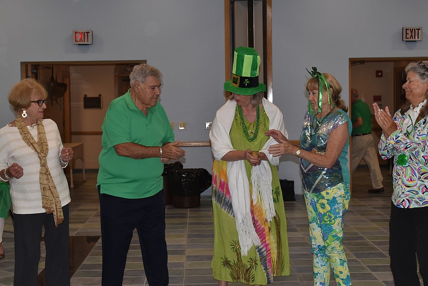 The winners who held the potato when the music stopped played again together.