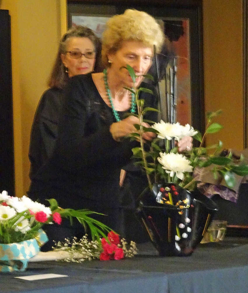 Polly Curran demonstrating ikebana. Photo courtesy of Barbara Jendrysik
