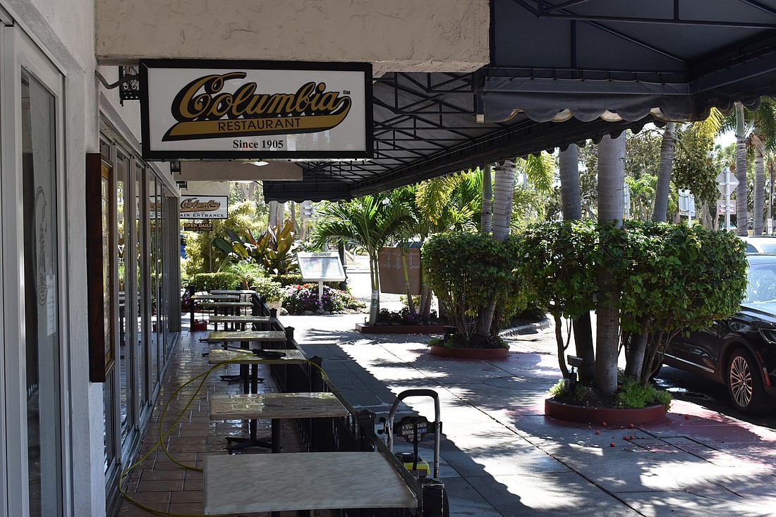Columbia Restaurant&#39;s outdoor dining area sits empty after the restaurant announced it would close indefinitely.